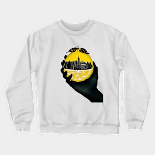 A hand holding a city inside a lemon Crewneck Sweatshirt